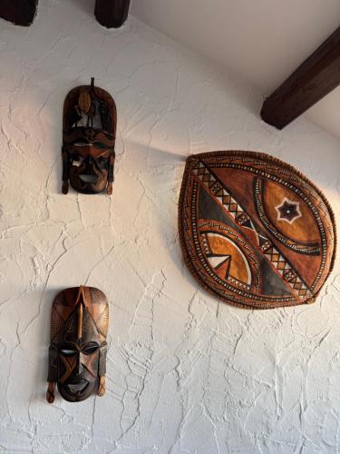 a wall with a pair of shoes on a wall at Attic Lagoon View in Lido