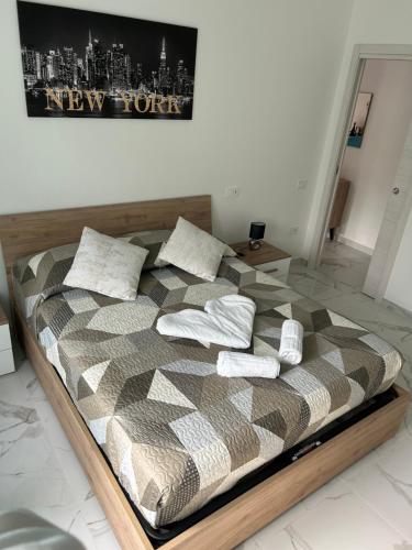 En eller flere senge i et værelse på Corso Italia Holiday Home