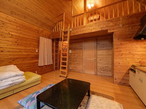 Postel nebo postele na pokoji v ubytování Aiwa no Mori Hotel