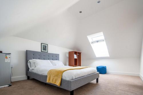 a bedroom with a large bed in a room at Double room in Bromley in Bromley
