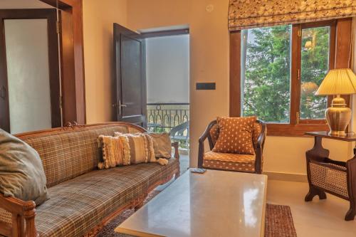 Coin salon dans l'établissement Almost Heaven Suites