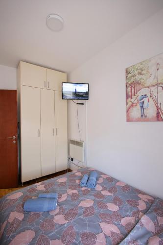 Llit o llits en una habitació de Apartman Lena