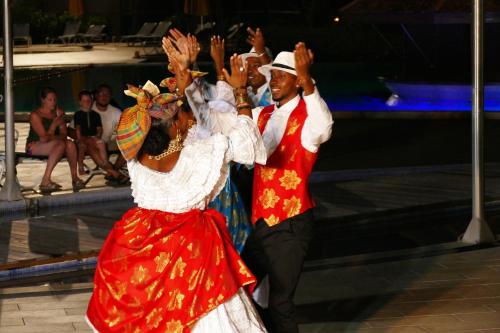 a man and a woman dancing on the ice at PIERRE & VACANCES Tobago 24 in Sainte-Luce