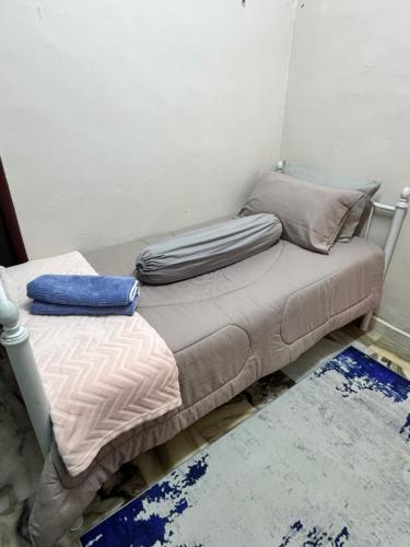 Ένα ή περισσότερα κρεβάτια σε δωμάτιο στο NuLya Homestay