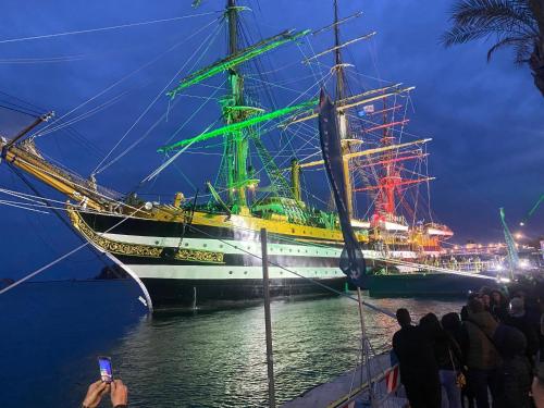a large ship docked in the water at night at Eterea Casa Vacanza in Brindisi