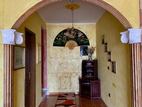 an arched hallway with an archway in a home at VilaHasa in Tërbuf