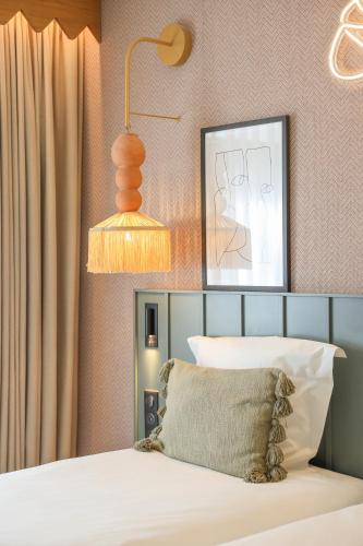 Bloom House Hôtel & SPAにあるベッド