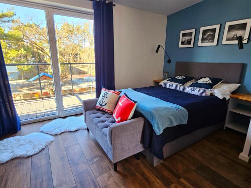 Ένα ή περισσότερα κρεβάτια σε δωμάτιο στο Apartament GRUNWALDZKA 105 z tarasem 5o m do plaży