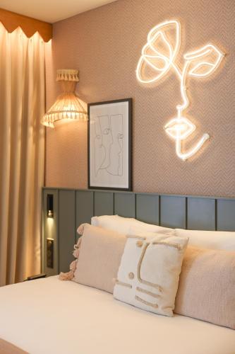 Bloom House Hôtel & SPAにあるベッド