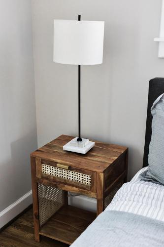 a table with a lamp on it next to a bed at Elmwood Park Retreat Renovated 3 Bed 2 Bath DT in Columbia