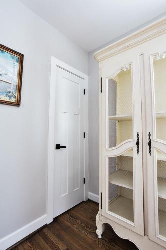a room with a white cabinet and a door at Elmwood Park Retreat Renovated 3 Bed 2 Bath DT in Columbia