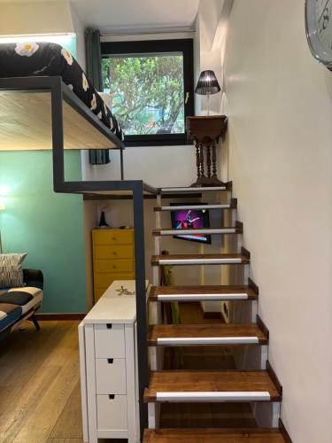 a room with a staircase and a bunk bed at Casa Chicca Free Parking in Genova