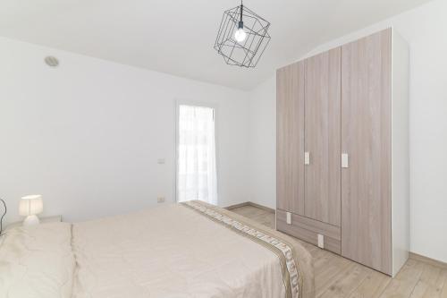 Katil atau katil-katil dalam bilik di Casa Virgi vista mare