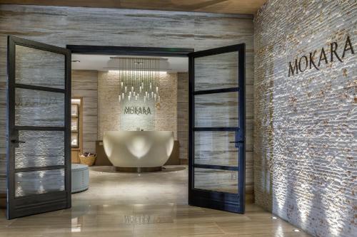 a bathroom with a large tub and a large window at Omni Louisville Hotel in Louisville