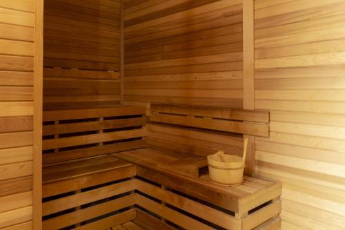 a wooden sauna with a bucket in it at Omni Louisville Hotel in Louisville