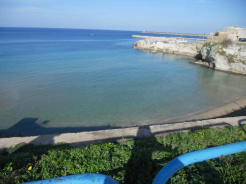 a shadow of a person looking at the water at Case Vacanze Terra Sinus in Terrasini