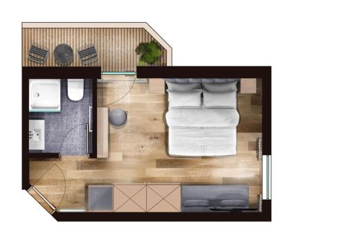 a floor plan of a room with a bed at Natur-Genuss-Hotel Sonnasita in Faschina
