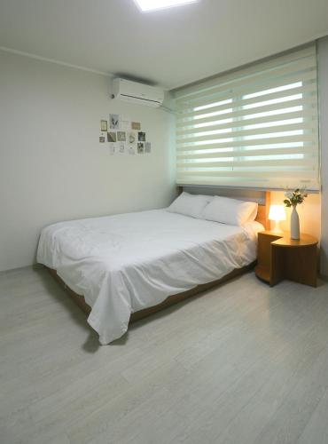 The Shim Anam 3rooms late check in-outにあるベッド