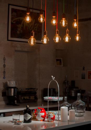 a kitchen with many lights hanging over a counter at Asuwari Suites Cappadocia in Ürgüp