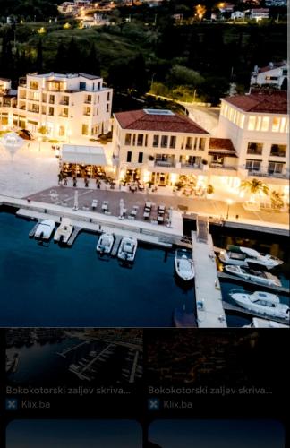 a view of a marina with boats in the water at Zdravka in Ðenovići