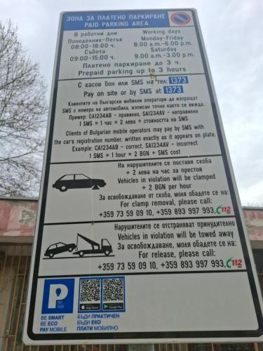 a parking sign for a car parking lot at 3 Rooms Apartment, Top Center, 1st Floor, AUBG, WiFi, PC i5 SSD, Tablet, AndroidMiTvBox, 3 LED TVs 200 Channels, Long Terrace, Self-Easy-Late Check-in, Stay Before Greece in Blagoevgrad