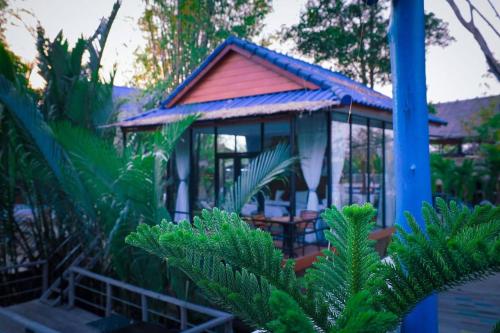 a gazebo in the middle of a garden at V-Relaxing Resort in Kampot