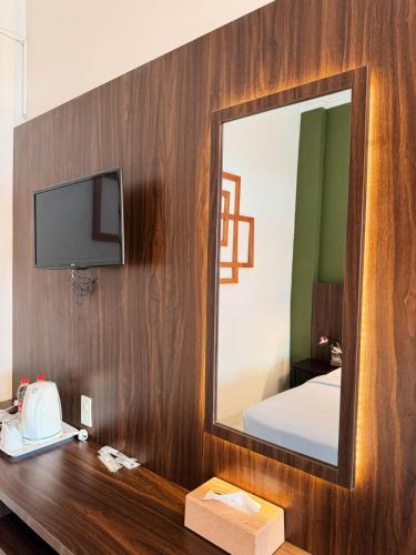 Hotel Ompu Hertiにあるベッド