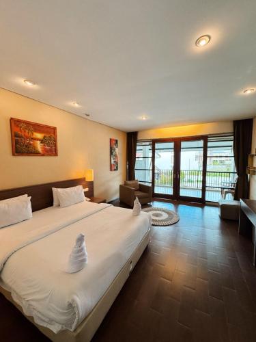 Hotel Ompu Hertiにあるベッド