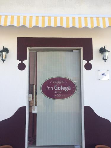 a sign on the front door of a im golged garage at Inn Golegã in Golegã