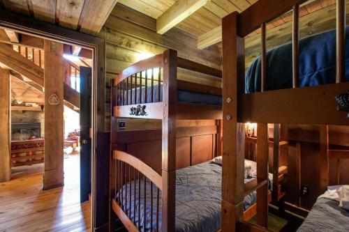 a bedroom with two bunk beds in a cabin at Mt Baker Rim Cabin 44 - A Cozy Rustic Cabin With Modern Charm in Glacier