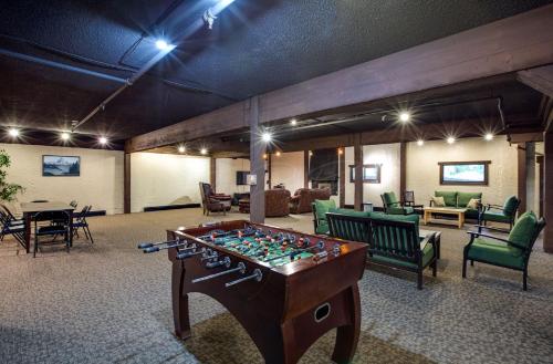 a room with a foosball table in the middle at Snowline Lodge - Condo 37 - A very cute condo - near the mountain, now has Wifi in Deming
