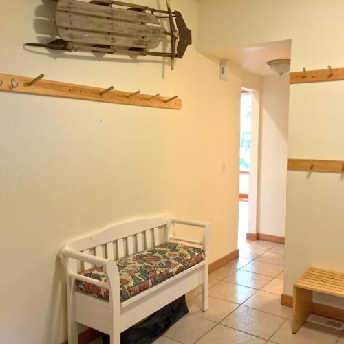 a room with a crib and a shelf on the wall at Mt Baker Rim Cabin 70 A pet friendly vacation home with a hot tub and wifi in Deming