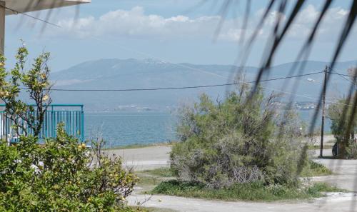 a view of the ocean from a house at Sea View Apartment in Chalkida