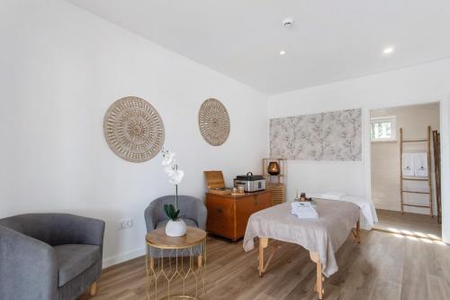 a living room with a couch and a table at Quinta dos Raposos- Nazaré Portugal in Nazaré