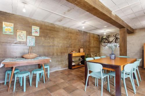 a dining room with a wooden table and chairs at Quinta dos Raposos- Nazaré Portugal in Nazaré