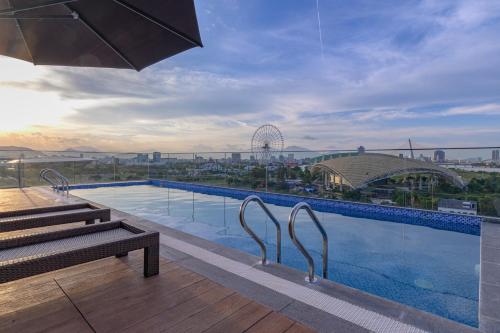 a large swimming pool on top of a building at LaBi Hotel n Apartment Danang in Da Nang