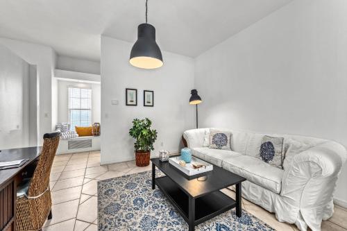 a living room with a couch and a table at Villa Champagne - 5322 in Siesta Key