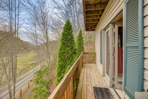 a porch of a house with two christmas trees at Mtn-View Home with Deck, Fire Pit and BBQ in Almond in Almond