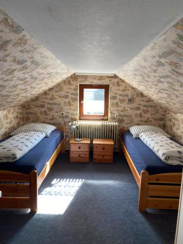 Postel nebo postele na pokoji v ubytování Ferienhaus Holzwald