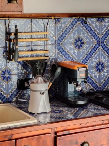 a kitchen counter with a mixer on a counter top at Casa Frufa in Terrasini