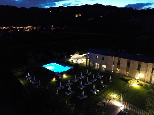 an overhead view of a building with a pool at night at Agriresort Villa Gelso- Adults Friendly in Vesime