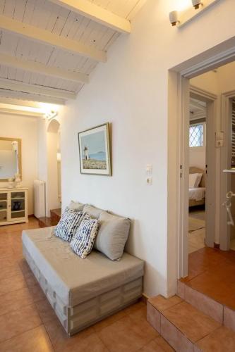 a room with a bed with pillows on it at Αeraki Villa at Heraion Lagoon in Loutraki