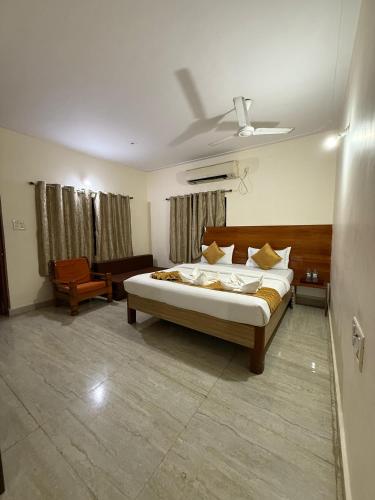 a bedroom with a bed in a room with a ceiling at Atithi farmhouse in Alibaug
