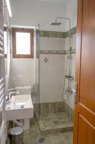 a bathroom with a shower and a sink at Rokani Studio I at Kalavrita Center in Kalavrita