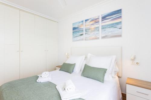 Ένα ή περισσότερα κρεβάτια σε δωμάτιο στο Eden Rentals Beach Paradise