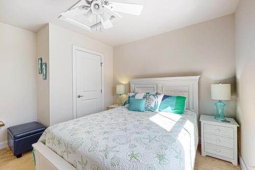 a bedroom with a bed and a ceiling fan at Bay Forest - 38770 Oyster Catcher in Ocean View