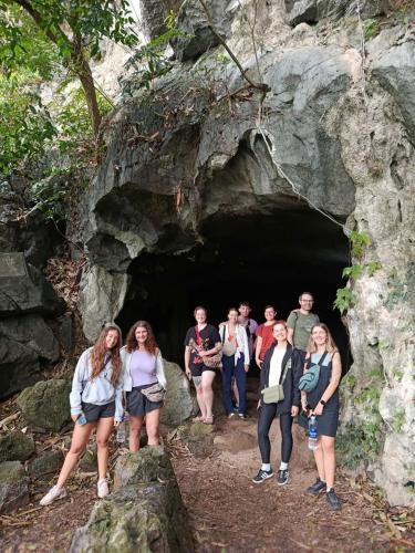 a group of people standing in a cave at Tam Coc Moutainside Homestay in Ninh Binh