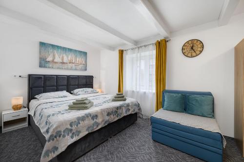 Postel nebo postele na pokoji v ubytování Apartments Stars