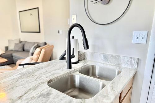 a kitchen sink in a kitchen with a living room at Laurelwood 44 with Wintergreen Advantage in Wintergreen