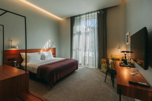 Postel nebo postele na pokoji v ubytování 1908 Lisboa Hotel